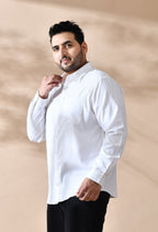 Man wearing a white shirt against a beige background